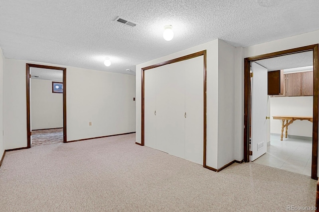 8277 Teller Ct, Arvada, CO 80003 - finished basement with a textured ceiling and light carpet