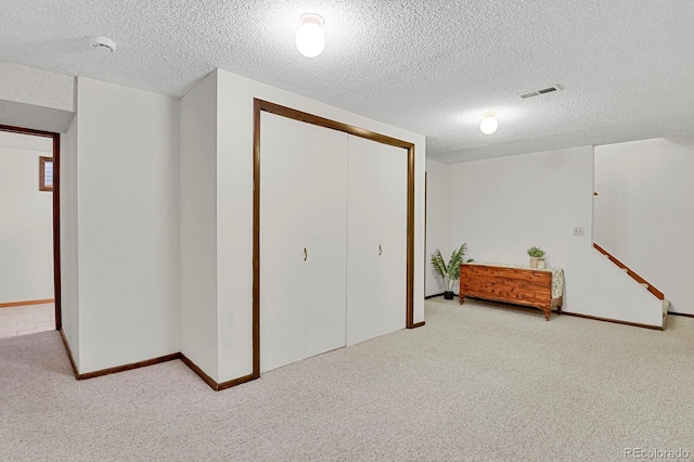 8277 Teller Ct, Arvada, CO 80003 - basement with carpet floors and a textured ceiling