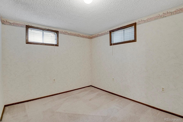 8277 Teller Ct, Arvada, CO 80003 - basement featuring a textured ceiling and light colored carpet