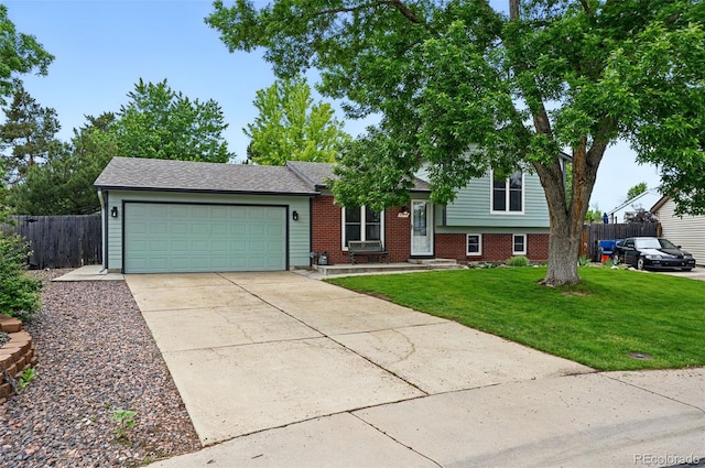 9315 Field Ln, Westminster, CO 80021 - tri-level home with an attached garage, concrete driveway, and brick siding