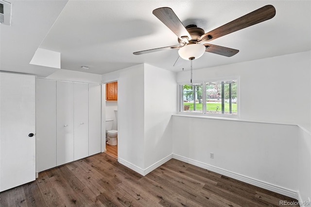 9315 Field Ln, Westminster, CO 80021 - unfurnished bedroom with wood finished floors, baseboards, a closet, and a ceiling fan