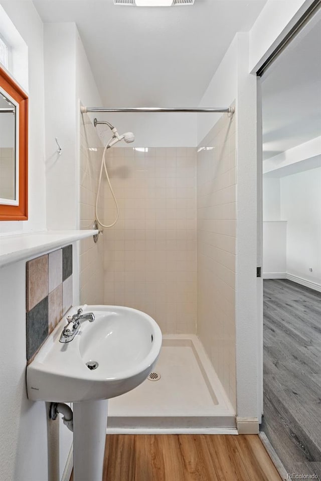 9315 Field Ln, Westminster, CO 80021 - full bathroom featuring a shower stall and wood finished floors