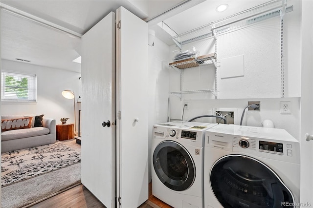 9315 Field Ln, Westminster, CO 80021 - washroom featuring separate washer and dryer and light wood-style floors