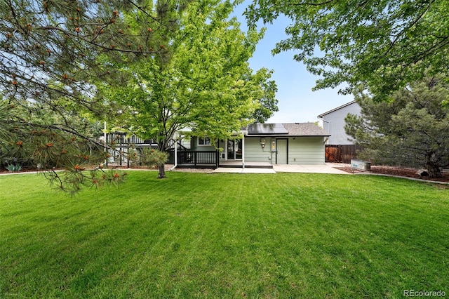 9315 Field Ln, Westminster, CO 80021 - back of property with roof mounted solar panels and a patio area