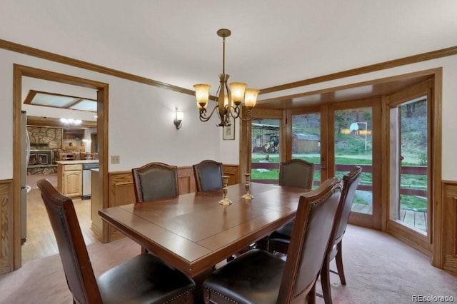 60 N County Highway 67, Sedalia, CO 80135 - dining room with a chandelier, ornamental molding, plenty of natural light, a wainscoted wall, and french doors