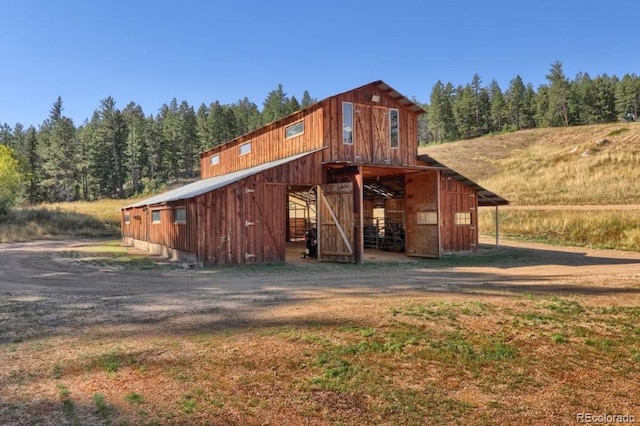 60 N County Highway 67, Sedalia, CO 80135 - view of outdoor structure with an exterior structure and a view of trees