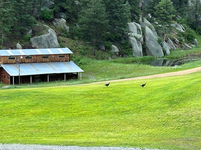 60 N County Highway 67, Sedalia, CO 80135 - view of grassy yard featuring an outdoor structure