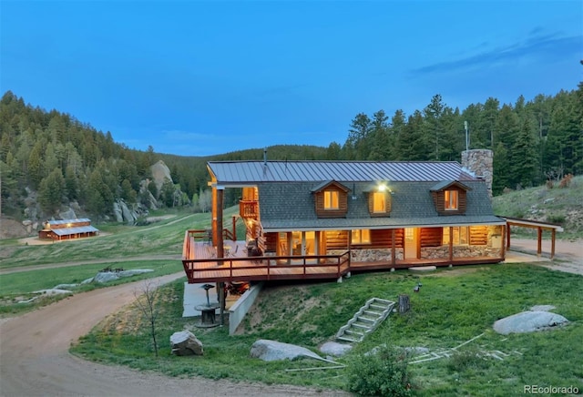 60 N County Highway 67, Sedalia, CO 80135 - rear view of property with a view of trees, a chimney, a yard, and log exterior