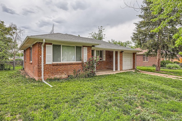 1325 Geneva St, Aurora, CO 80010 - ranch-style home with a garage, brick siding, and driveway