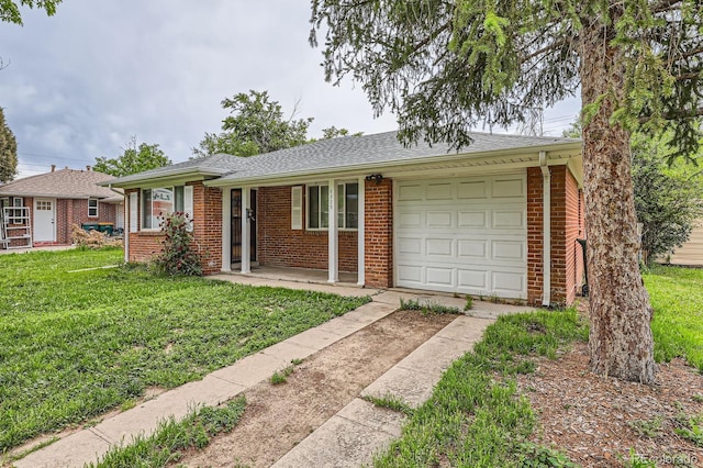 1325 Geneva St, Aurora, CO 80010 - ranch-style home with an attached garage, concrete driveway, a front yard, and brick siding