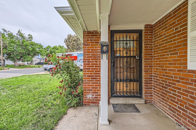 1325 Geneva St, Aurora, CO 80010 - doorway to property with brick siding