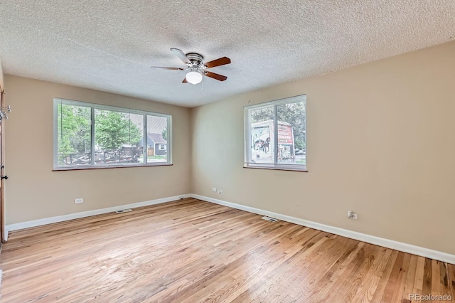 1325 Geneva St, Aurora, CO 80010 - spare room with a ceiling fan, light wood-type flooring, baseboards, and a textured ceiling