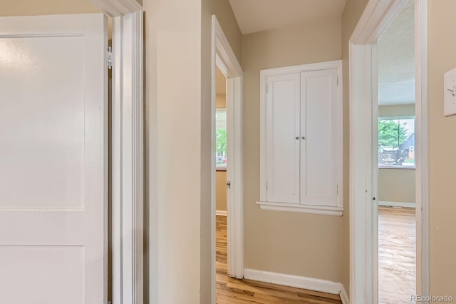 1325 Geneva St, Aurora, CO 80010 - corridor featuring light wood finished floors and baseboards