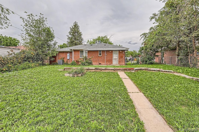 1325 Geneva St, Aurora, CO 80010 - rear view of property with brick siding and central AC unit