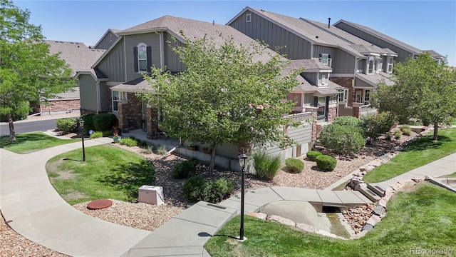 4718 Raven Run, Broomfield, CO 80023 - view of side of property with board and batten siding and a shingled roof