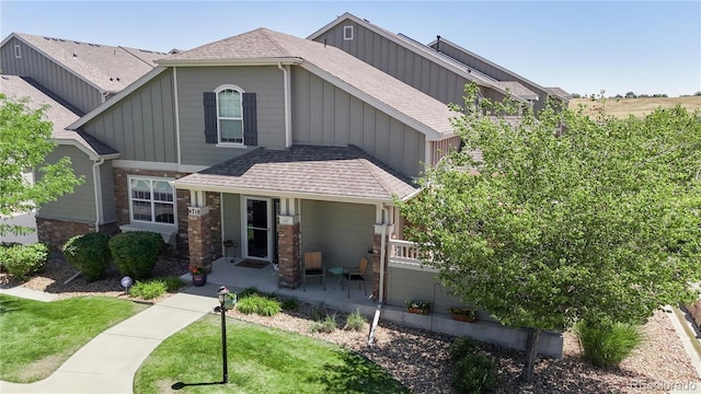 4718 Raven Run, Broomfield, CO 80023 - craftsman inspired home with board and batten siding, roof with shingles, and a front lawn