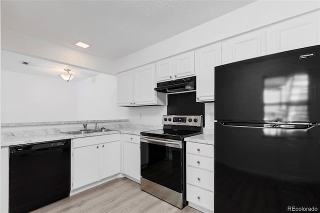 kitchen with white cabinets, ventilation hood, black appliances, and a sink