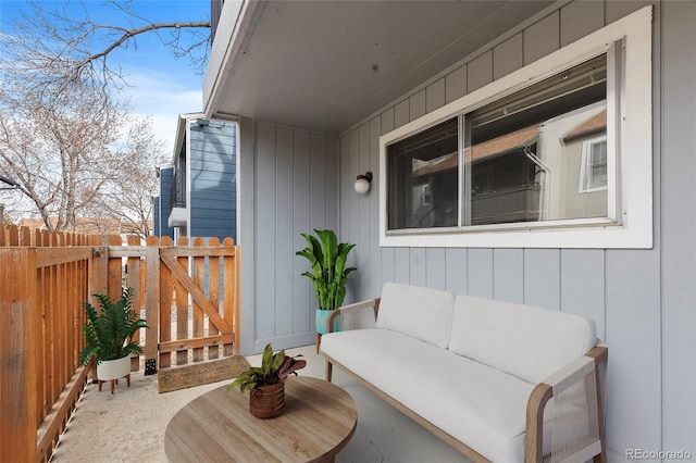 view of patio featuring an outdoor living space and fence