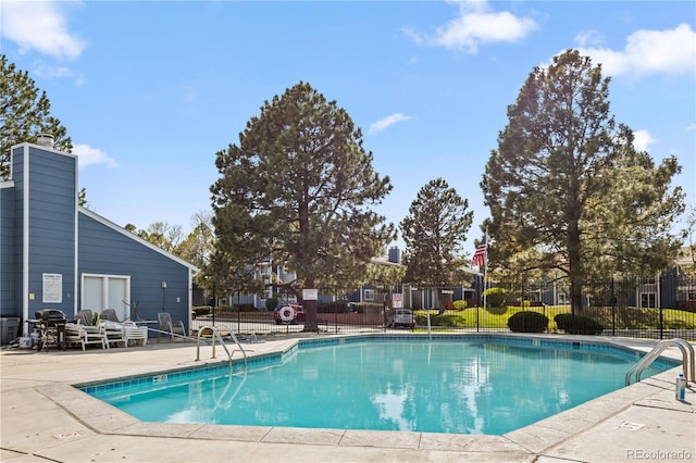 community pool featuring fence
