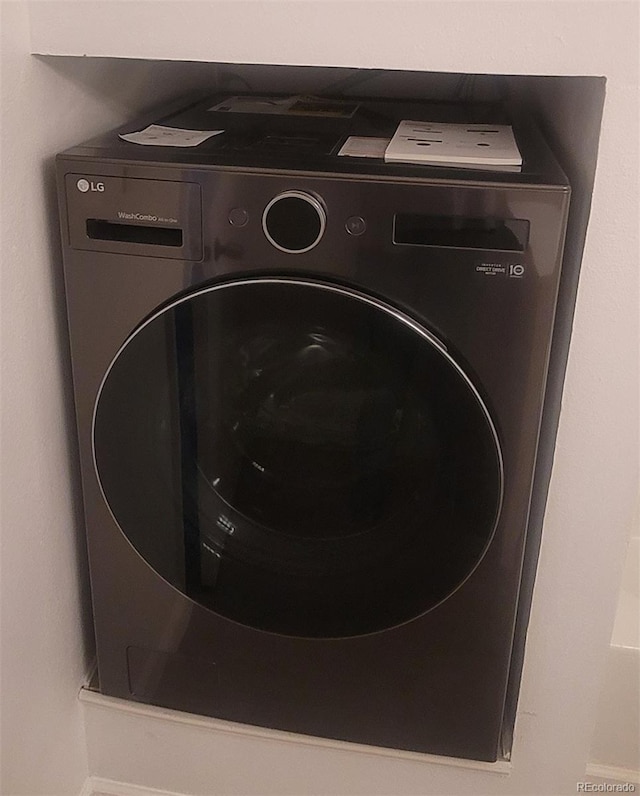 7185 S Gaylord St Unit G13, Littleton, CO 80122 - washroom featuring washer / dryer