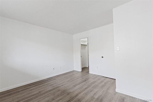 7185 S Gaylord St Unit G13, Littleton, CO 80122 - unfurnished room with wood finished floors and baseboards