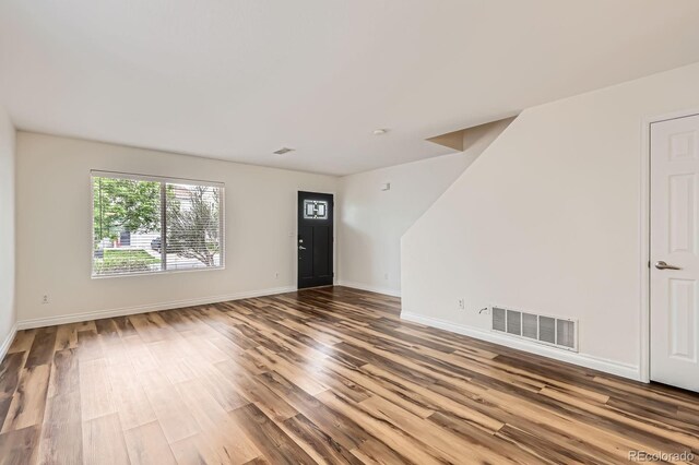 5120 Perth St, Denver, CO 80249 - spare room featuring wood finished floors and baseboards