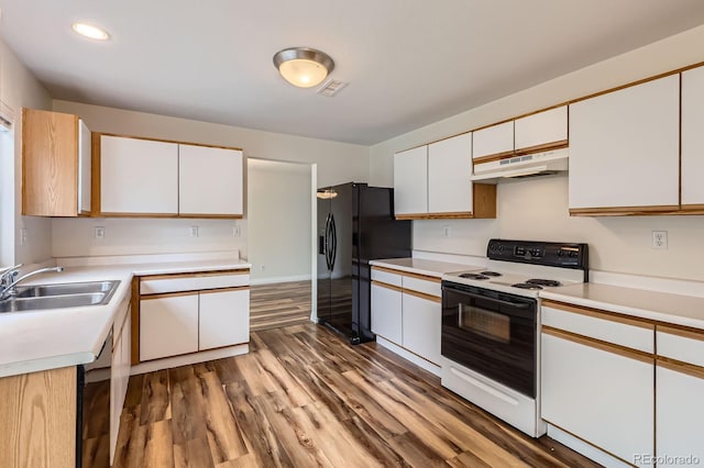 5120 Perth St, Denver, CO 80249 - kitchen featuring black appliances, a sink, under cabinet range hood, wood finished floors, and light countertops