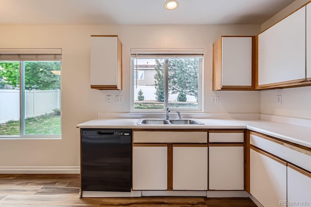 5120 Perth St, Denver, CO 80249 - kitchen featuring dishwasher, a sink, light countertops, healthy amount of natural light, and recessed lighting