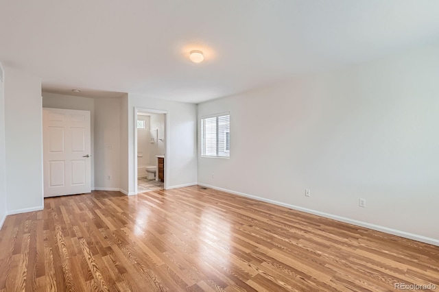 5120 Perth St, Denver, CO 80249 - unfurnished bedroom with baseboards, light wood-type flooring, and ensuite bath