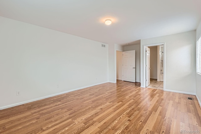 5120 Perth St, Denver, CO 80249 - unfurnished bedroom featuring light wood finished floors, baseboards, and ensuite bathroom