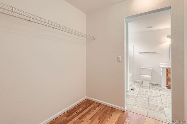 5120 Perth St, Denver, CO 80249 - walk in closet featuring light wood finished floors
