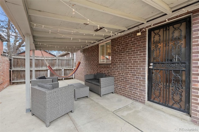 view of patio featuring fence