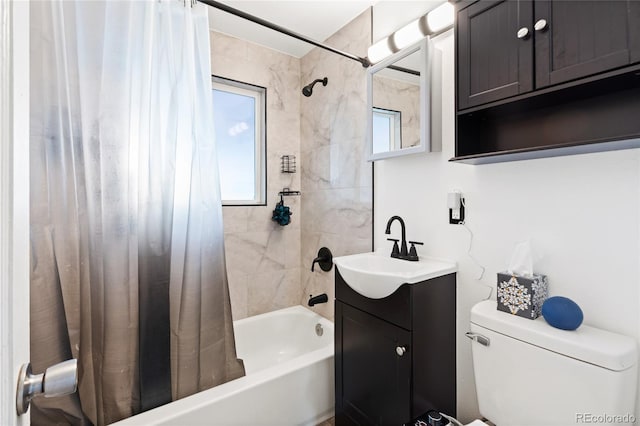 bathroom with shower / bath combo, vanity, and toilet