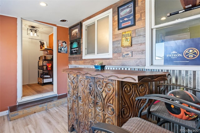 bar with wood finished floors and recessed lighting