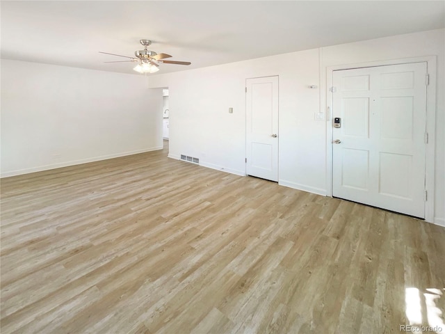 1298 S Seneca Way, Denver, CO 80223 - unfurnished living room featuring ceiling fan and light wood-style floors