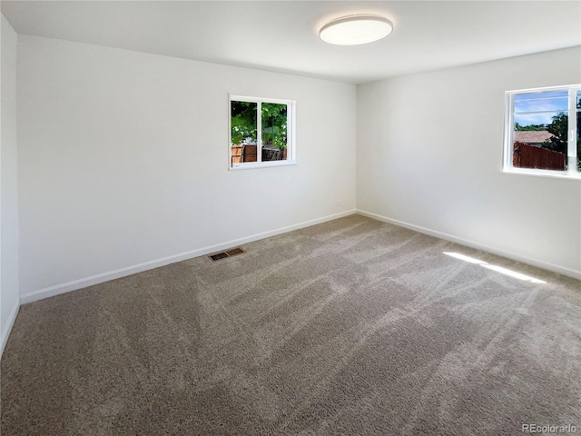 1298 S Seneca Way, Denver, CO 80223 - carpeted empty room featuring baseboards