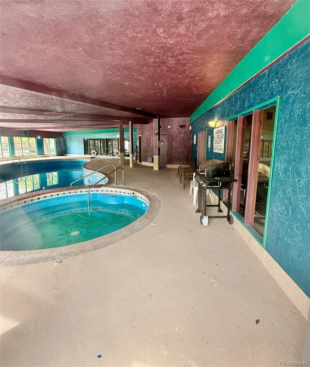 indoor pool with area for grilling