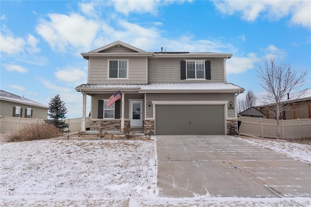 view of front of house with a garage and covered porch