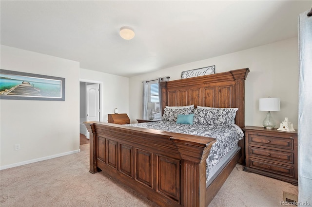 bedroom featuring light carpet