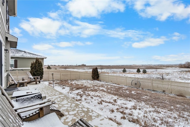 view of yard layered in snow