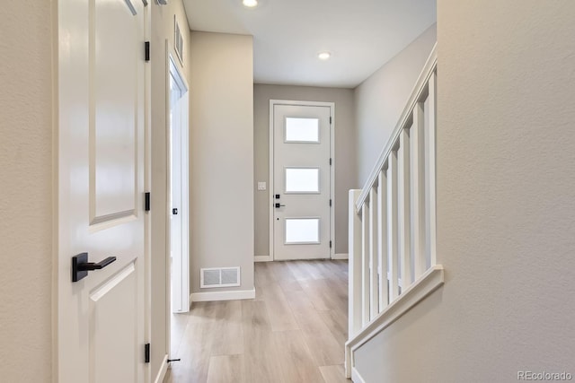 entryway with light hardwood / wood-style floors