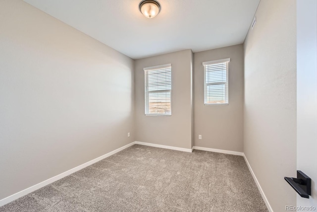 spare room featuring carpet flooring