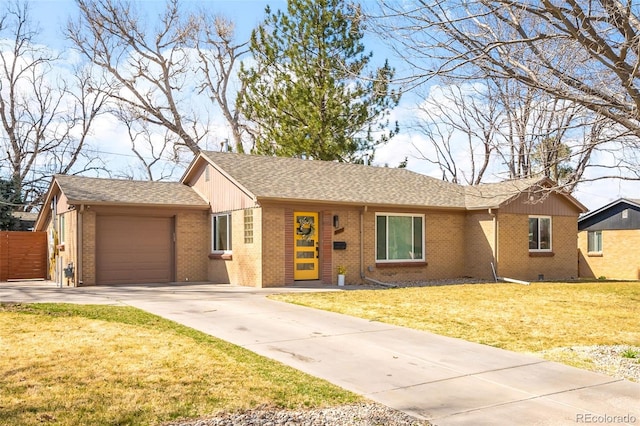 3925 Newland St, Wheat Ridge, CO 80033 - ranch-style home featuring brick siding, driveway, a garage, and roof with shingles