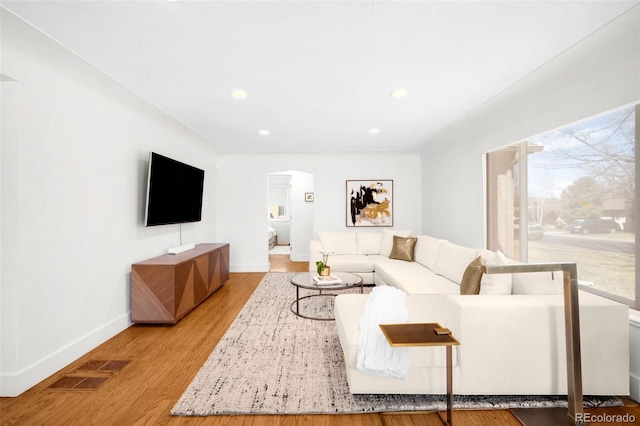 3925 Newland St, Wheat Ridge, CO 80033 - living area featuring baseboards, recessed lighting, and wood finished floors