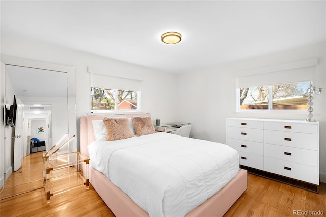 3925 Newland St, Wheat Ridge, CO 80033 - bedroom featuring light wood-style floors