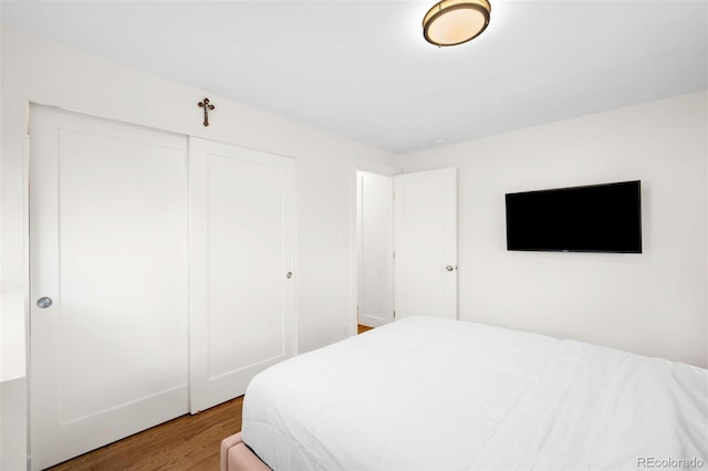 3925 Newland St, Wheat Ridge, CO 80033 - bedroom with wood finished floors and a closet