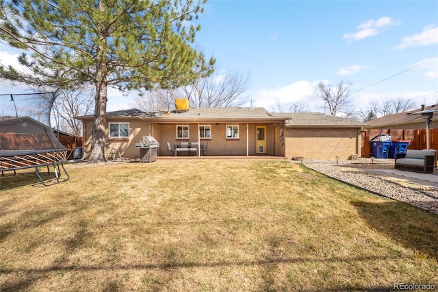 3925 Newland St, Wheat Ridge, CO 80033 - back of property with brick siding and a patio