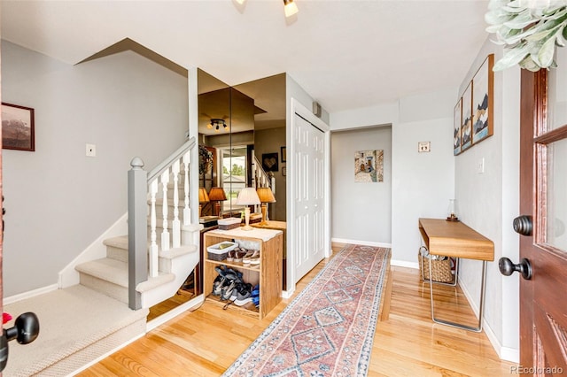 4645 W Temple Pl, Denver, CO 80236 - entryway featuring light wood-type flooring and stairway