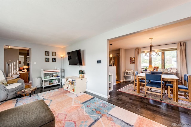 4645 W Temple Pl, Denver, CO 80236 - living room with wood finished floors, a chandelier, and stairway
