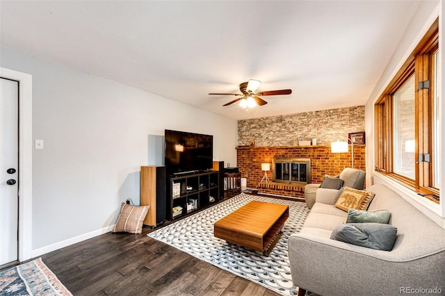4645 W Temple Pl, Denver, CO 80236 - living room featuring dark wood finished floors, ceiling fan, and a brick fireplace